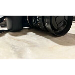 sony mirrorless APSC digital camera NEX 5 with adapter and Minolta lens.